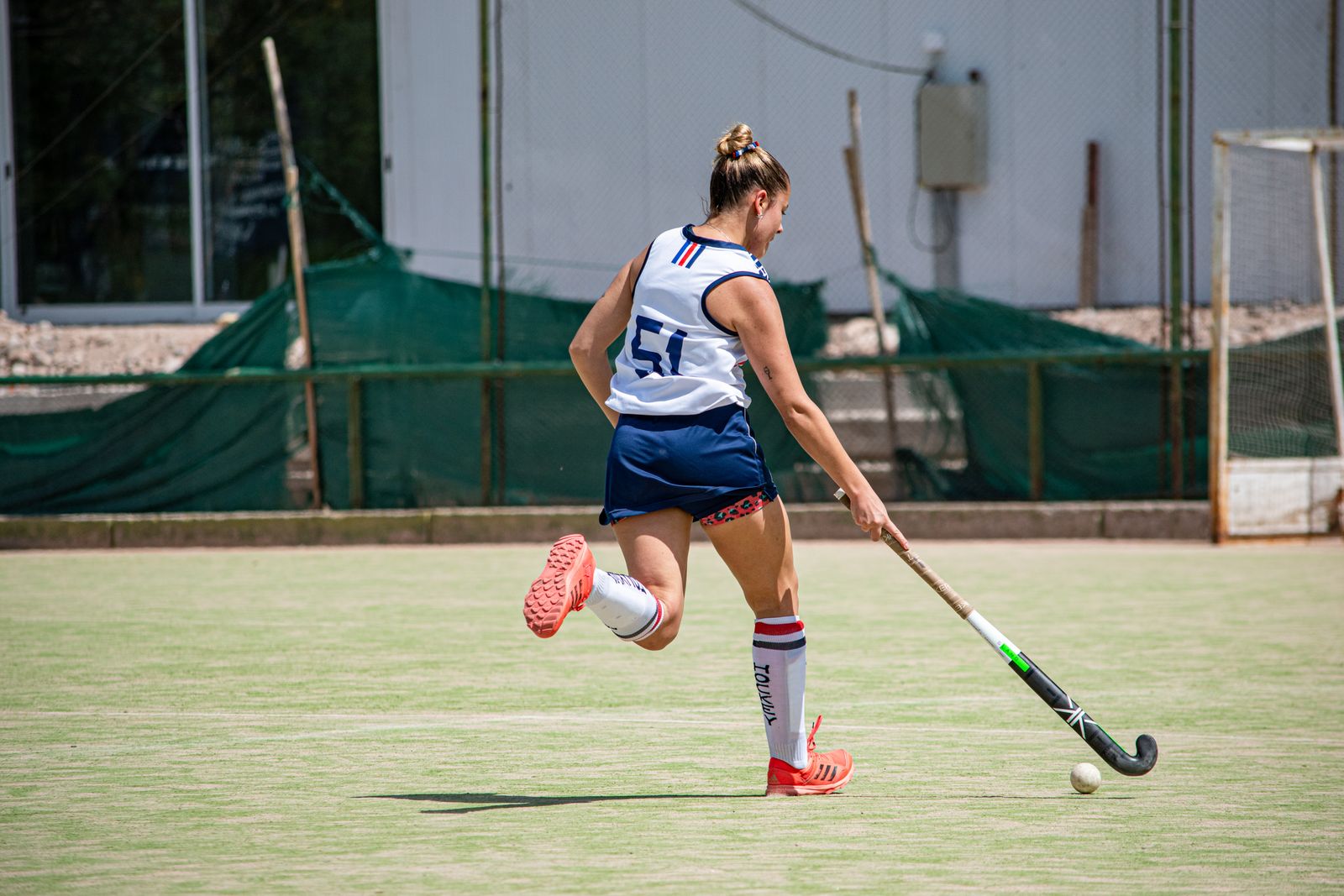 Field hockey ball on artificial turf – a player in action
